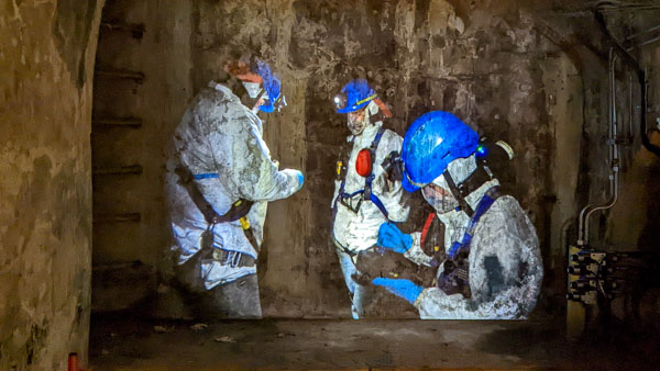 Projection of goutiers or sewer workers in the Paris Sewers Museum.