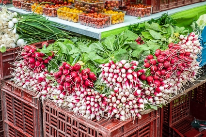 Radishes at Saturday market in Places des Halles, Beauvais, France