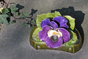 Ceramic flowers on grave, Le Cimetire des chiens d'Asnires-sur-Seine near Paris